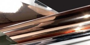 Rolls and sheets of metallized polyester film