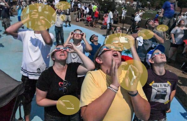 Eclipse viewers fumbling with phones.